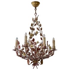 A cheery patinated Italian six-light tôle flower chandelier from the 1960s. The charming piece will add a touch of freshness to whatever room you place it in. Measures: Diameter 50 cm. Height fixture 60 cm. Total height 80 cm. Six E14 bulbs. Starburst Chandelier, Chandelier Makeover, Porcelain Dolls For Sale, Blown Glass Chandelier, Shop Displays, Flower Chandelier, Flush Mount Chandelier, Floral Chandelier, Porcelain Roses