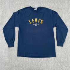 Size: L Chest - 22in Length - 29in Sleeve - 23in General wear, Levis made in USA tag, simple Levi's hit on the front, navy & yellow long sleeve, no major flaws. Royal Blue Sweater, Nascar Jacket, Varsity Cardigan, Levis Shirt, Yellow Long Sleeve, 90s Sweatshirt, Vintage Long Sleeve, Vintage Levis, Blue Sweaters