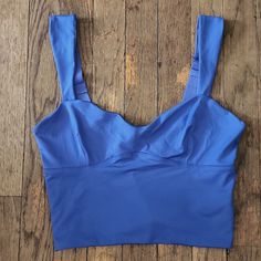 New With Tags! Chest: 29"-35" Waist: 24"-30" Length: 15.5" Adjustable Strap Shell: 86% Nylon, 14% Spandex Lining: 95% Nylon, 5% Spandex Color: Royal Blue Blue Tank Top That Is Bra Friendly, Blue Cami Crop Top Bra Friendly, Blue Bra-friendly Tank Top For Spring, Trendy Bra-friendly Blue Tops, Blue Tank Top, Bra-friendly, Chic Blue Seamless Tank Top, Trendy Blue Bra-friendly Tops, Spring Blue Bra-friendly Tank Top, Blue Tank Top, Bra Friendly