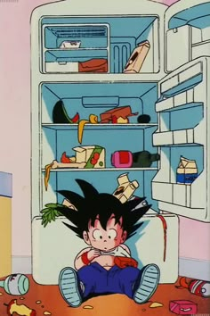 a young person laying on the floor in front of an open refrigerator filled with food