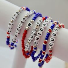 Chicago Cubs game day bracelets.  Show your love for the Cubbies with these fun elastic beaded bracelets. Wear one or stack a bunch.   Made on elastic stretch cording with 2mm seed beads, silver spacers and acrylic letter beads.  Makes a great gift for Cub fans.    Made to order.  Can be made for any sports team.  Message us with your team name and colors and we can customize a collection for you. Ships in 2-3 business days. For quantities of 10 or more please allow 5-7 business days for process Sports Team Beaded Bracelets, Phillies Clay Bead Bracelet, Adjustable Team Spirit Bracelets With Letter Beads, Team Spirit Bracelets With Letter Beads, Game Day Bracelets With Letter And Round Beads, Adjustable Multicolor Beaded Bracelets For Team Spirit, Adjustable Multicolor Beaded Bracelets For Game Day, Adjustable Letter Beads Stretch Bracelet For Sports Events, Sports Bracelet