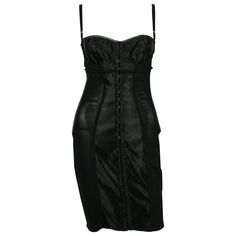 DOLCE & GABBANA black lingerie corset bustier dress. This sexy dress features : - Black mesh and heavy satin. - Stretchy. - Fitted knee-length. - Satin bra topped with lace detail. - Whalebones. - Spaghetti straps. - Hook & eye fastening at the front. Label reads DOLCE & GABBANA Made in Italy. Size tag reads : 38. Photographied on a XS mannequin (size FR 36). Please check measurements. Composition label reads : 81 % Nylon / 19 % Elastane. Indicative measurements taken laid flat and unstretched ( Fashion Dresses Black, Black Cocktail Dresses, Dresses Fitted, Dresses Corset, Knee Length Cocktail Dress, Cocktail Dress Vintage, Vintage Corset, Corset Bustier, Corset Lingerie