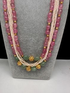 Rose Quartz Emerald Pearls Nakshi Multi Layer Necklace Only Neckalce no earringsColor : GoldenSize : Necklace Length : 22 Inches Approx;Stones : Pearl Real Emeralds Rose Quartz Nakshi Balls Pink Traditional Necklace With Stone Work, Traditional Pink Necklace With Stone Work, Traditional Pink Stone Work Necklaces, Pink Gemstone Beads Necklace For Wedding, Traditional Pink Jewelry With Stones, Pink Jewelry With Stones For Celebration, Pink Temple Jewelry Necklace With Stone Work, Pink Faceted Beads Gems And Cabochons For Gifts, Pink Stone Work Temple Jewelry Necklace