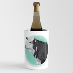 a bottle of wine with a photo of a cow on the front and inside it