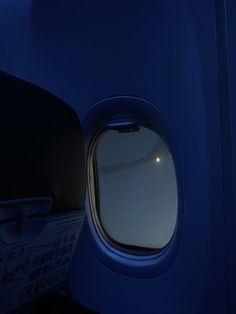 an airplane's window is lit up at night