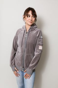 Our ladies' hoodie in a luxurious medium-weight Velour for the holidays. You can wear this super comfortable hoodie from the gym, on your errands, and straight into the holidays nights with this soft and cozy jacket. Equipped with front pockets, a sleeve pocket, and multiple inside pockets, there are plenty of options on this hoodie to store your phone on the move. Available in Black, Scarlett Red, and Smoke Silver Multiple “Phone Safe” inside pockets – we love options! Water repellent sleeve po French Terry Loungewear Hoodie, Cozy Hooded Activewear, Cozy Hooded Winter Activewear, Athleisure Hooded Jacket With Kangaroo Pocket For Loungewear, Sporty Hooded Jacket With Double-lined Hood For Loungewear, Cozy Hooded Activewear For Fall, Comfy Winter Activewear Hoodie, Winter French Terry Hoodie For Loungewear, Cozy Winter Hoodie Activewear