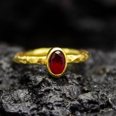 Tiny Gold Ruby Hammered Ring | Handmade Stackable Ring | 925 Silver 24K Gold Plated | Minimalist Dainty Jewelry | Simple Ring  Handcrafted hammered  Silver Ring Our shop offer free ring sizing and color options.(Oxidized(Black),Gold Plated) Metal : 925 Sterling Silver Plated : 24K Gold  Gemstone : Lab  Ruby Gem Size : 6 X 4 mm Band Size : 2 mm Ring Weight : 2.43 grams Ring Size : US 6 (The size you want is made for free). (We used the US standard sizing) Plating Options(FREE) : Gold,Silver  **Custom Orders is Made** As pellada family, we will be happy to help you if you contact us with the photo and dimensions of the design you want. To return back to Pellada Shop Home Page,Click here! https://www.etsy.com/shop/Pellada Thank you for shopping!          Pellada Hammered Silver Ring, Hammered Ring, Hammered Rings, Simple Ring, Jewelry Simple, Hammered Gold, Stackable Ring, Gold Plated Rings, Hammered Silver