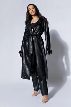 Isla Pu Trench - Black- MESHKI U.S Sleek Belted Fall Outerwear, Sleek Belted Outerwear For Fall, Sleek Belted Outerwear For Winter, Sleek Belted Winter Outerwear, Sleek Winter Outerwear With Belt, Sleek Solid Outerwear For Fall, Sleek Winter Belted Outerwear, Sleek Long Coat For Winter, Sleek Long Winter Coat