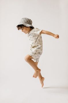 These Rompers are nothing short of a perfect summer outfit! With a sea-inspired print and long front opening for easy changing, this short sleeve staple will take them from pool to playtime in the softest organic cotton. Organic Cotton & Dyes Ethically Made Summer Cotton Sleepwear, Cotton Summer Sleepwear, Cotton Sleepwear For Summer Vacation, Summer Cotton Sleepwear With Graphic Print, Cotton Graphic Print Sleepwear For Summer, Playful Organic Cotton Tops For Playwear, Summer Cotton Sleepwear For Beach, Short Sleeve Summer Sleepwear For Beach, Short Sleeve Sleepwear For Summer Beach