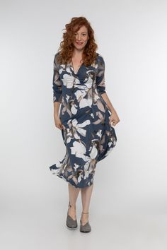 "A charming and wonderfully light long sleeve dress to feel unique and feminine in all year long. With an a-line silhouette, a smart v-neckline, a flattering midi length and a generous loose cut at the waist, this denim blue dress is comfortable to wear while staying feminine and chic. Wear it casually day to day with sneakers and boots, or dress it up with heels to a party.  Perfect for casual or evening wear.  Model is wearing the color  \"Printed Denim Blue\" A variety of colors is waiting for you to choose from...just look at the color chart! Each dress is sustainably made from high quality fabrics.  MEASUREMENTS:  It's best to measure your bust (with a bra on) and hips at the widest point, and your waist at the narrowest point.  If you're unsure about which size to choose, please send Modest V-neck Midi Dress For Spring, Blue Long Sleeve V-neck Dress For Spring, Elegant Blue Floral Print V-neck Dress, Blue V-neck Long Sleeve Dress, Spring Blue Midi Dress With Surplice Neckline, Blue Midi Dress With Surplice Neckline For Spring, Feminine Fall Dress With Surplice Neckline, Elegant Midi Dress With Surplice Neckline For Brunch, V-neck Long Sleeve Dress For Spring Workwear