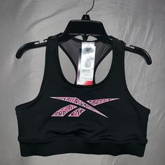 Brand New Reebok Sports Bra Size Large Compressive Racerback Sports Bra With Built-in Bra, Compressive Sports Racerback Sports Bra, Nylon Racerback Sports Bra With Built-in Bra, Reebok Retro, Technical Moisture-wicking Racerback Sports Bra, Black Compressive Technical Sports Bra, Pink Reebok, Running Sports Bra, Black Reebok