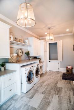 a washer and dryer in a white laundry room