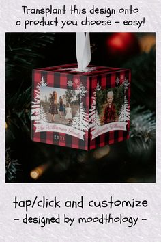 an ornament hanging from a christmas tree decorated with family photos and snowflakes