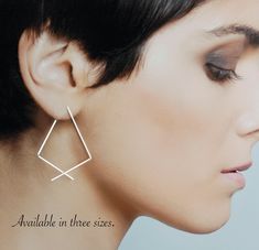 "Two Sizes Available. Minimal triangle hoops handmade from sterling silver. These open hoops easily thread through your ears for an updated look. A simple and elegant style that looks great with a dress or your favorite jeans. Made from ethically mined silver, they are cold forged and tumbled for strength and shine. All of my work is carefully crafted with attention to detail to last for many years of enjoyment. Details at a glance >Sturdy 20 gauge square sterling silver. The square wire I us Minimalist Triangle Hoop Earrings As Gift, Handmade Minimalist Triangle Earrings, Minimalist Handmade Triangle Earrings, Earrings Triangle, Geometric Hoop Earrings, Minimal Earrings, Triangle Earrings, Hammered Silver, Modern Earrings