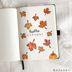 an open book with autumn leaves and words written on the pages that read hello october