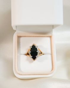 * Ring Material: Onyx, Diamond, 14K Yellow Gold * Ring Dimensions: 20.8 (w) 12 (l) x 13.2 MM Top Design, 2.5 MM Tapering Band * Size: 6.25 * Stone Weight & sizes: Onyx - 17.5x9.5MM , Diamond-0.06ct * Overall weight: 5.4g Heirloom Black Enamel Rings For Wedding, Black 14k Gold Signet Ring For Wedding, Oval Black Enamel Wedding Rings, Heirloom Black Enamel Wedding Rings, Fine Jewelry Black Enamel Rings For Wedding, Wedding Rings With Black Enamel In Fine Jewelry Style, Black Oval Enamel Ring For Anniversary, Black Gemstone Signet Ring For Wedding, Fine Jewelry Black Enamel Wedding Rings