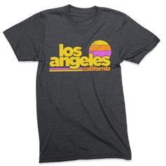 Free Shipping!! Part of our Radical States series, the Los Angeles Sunset shirt is a tribute to old school LA. A retro style and vintage inspired graphic tee printed on a very comfortable, nicely fit shirt. Heather Dark Grey vintage style tee. Men's / Women's / Unisex We use shirts and tanks from companies dedicated to ethical standards of conduct. They are child labor free and sweat shop free. The printing uses inks that are water based and eco-friendly. View our full store: https://www.etsy.co Retro Text Print T-shirt For Beach, Summer Throwback Tops With Graphic Print, Retro Text Print T-shirt, Retro Tri-blend T-shirt, Retro Tri-blend Pre-shrunk T-shirt, Retro Beach T-shirt With Text Print, Retro Pre-shrunk T-shirt For Summer, Retro Short Sleeve Surfing T-shirt, Retro Tri-blend Graphic Print Tops