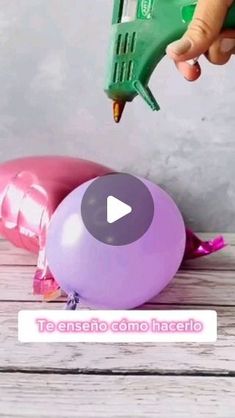 a video demonstrating how to use glue on balloons with the help of a balloon blower