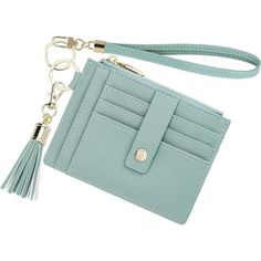 a small blue purse with a tasselled keychain