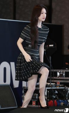 a woman standing on top of a stage