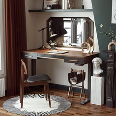 a desk with a mirror, chair and vase on it