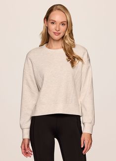 Our In The Studio Cropped Pullover combines a classic crewneck design and super soft, trendy scuba fabric for a lightweight pullover you can take from studio to street. A slightly cropped length is complemented by a relaxed fit, dropped shoulders and sporty seaming detail that allow for easy styling and layering. Throw this cute crop sweatshirt over a sports bra for a workout or pair it with jeans for a casual-cute look. Fall Layering Crew Neck Activewear, Fall Cropped Crew Neck Sweater With Ribbed Waistband, Fall Crew Neck Cropped Sweater With Ribbed Waistband, Crew Neck Cropped Sweater For Loungewear, Crew Neck Cropped Sweater With Ribbed Waistband For Fall, Relaxed Fit Ribbed Waistband Crew Neck Cropped Sweater, Sporty Cropped Sweater With Ribbed Waistband, Versatile Crew Neck Sweatshirt For Spring, Stretch Cropped Sweater With Ribbed Crew Neck