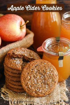 apple cider cookies with apples in the background and jars of honey on the table