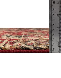 an area rug with a ruler on it