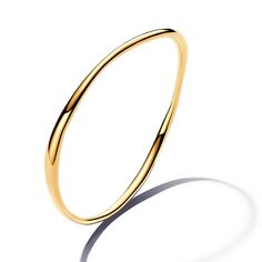 From Pandora, the Organically Shaped Bangle is a sleek style essential. This 14k gold-plated bangle features a wavy profile that varies in thickness, creating a sense of movement and a subtle undulating effect. Inspired by the natural lines and curves found in nature, this modern piece is effortlessly elegant. Stack this bangle up the arm with your other favorite bracelets and bangles, or let it stand alone as a lesson in simple beauty. Pandora Style #: 563317C00-2 Sleek Polished Bangle Jewelry, Sleek Polished Bangle Bracelet, Elegant Hoop Bangle With Polished Finish, Modern Yellow Gold Bangle With Polished Finish, Modern Hoop Gold Bracelet For Formal Events, Modern Gold Hoop Bracelet For Formal Occasions, Modern Flexible Gold Bangle Bracelet, Flexible Modern 14k Gold Bangle, Modern Twist Bangle With Polished Finish