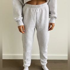 These Are High-Rise Sweatpants With A Slim Leg And Elastic Cuffs. They're Made With Tna’s Cozy Fleece Premium, Midweight Fleece With A Soft-Brushed Back, Sueded Face And Cloud-Nine Cozy Feel. They've Been Recently Redesigned For An Even More Flattering Fit. Winter Long Joggers For Lounging, Winter Joggers For Lounging, Winter Cozy Joggers, Cozy Fit Winter Joggers, Winter Sportswear Bottoms For Lounging, Cozy Winter Joggers For Lounging, Cozy Winter Lounging Joggers, Winter Loungewear Sweats, Winter Loungewear Sportswear Sweatpants