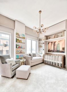 a living room filled with furniture and a baby crib