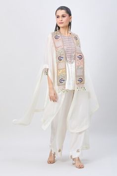 Ivory organza cape with peacock, pearl and zardozi embroidered broad border. Comes with embroidered yoke short kurta and sequin embroidered hem pant. - Aza Fashions Bohemian White Palazzo Set With Dupatta, White Tops With Dupatta For Festive Occasions, Beige Palazzo Set With Sheer Dupatta, Bohemian Cream Sets With Dupatta, Bohemian Cream Set With Dupatta, Bohemian Off White Chanderi Kurta, White Sleeveless Traditional Wear With Resham Embroidery, Beige Dupatta For Navratri, Beige Bohemian Sets With Dupatta