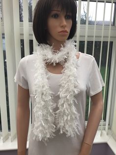 "This long ice white  boa scarf is made from a ribbon type yarn, that has a certain style to it, giving it a glamorous look that's both fashionable & very smart. It's pure white colour means it will mix and match with any colour, as well as being suitable for any outfit or event. It would make a great accessory for a staff party, meal out, leaving do, or as a gift for any female friend or relative.  Hand wash, or gentle machine wash -72% nylon, 19% acrylic, 9% polyester  Code - SCA 170 Approx size 135cm (53\") long x 15cm (6\") wide I have been established for several years, & have won awards for my scarves, as they are so versatile & easy to wear. The shawls, long & infinity scarves have evolved as a result of customer requests, & are proving to be equally as popular. I have also been int Elegant White Winter Scarf, Staff Party, White Scarf, A Staff, White Scarves, White Accessories, Glamorous Look, Female Friends, Gift For Mum