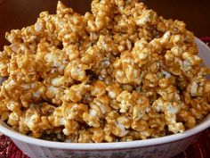 a white bowl filled with caramel popcorn