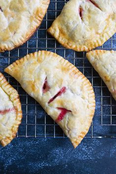 four pies on a cooling rack ready to be eaten