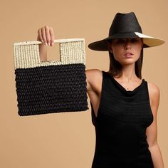 Meet the newest version of our Grenada bag in a medium clutch style. Made from Toquilla straw, with integrated handles. Pack it for your next tropical getaway. •Handmade in Ecuador from 100% Natural Straw •Measurements: 13 in x 12.5 in Chic Rectangular Straw Clutch, Chic Crochet Bag With Detachable Handle For Vacation, Summer Square Straw Bag With Detachable Handle, Chic Rectangular Beach Bag For Day Out, Black Rectangular Straw Bag For Day Out, Chic Black Straw Bag For Spring, Spring Day Out Rectangular Clutch, Black Rectangular Straw Bag For Spring, Summer Straw Clutch With Braided Handles