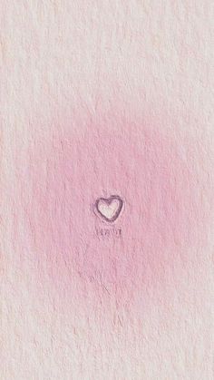 a heart drawn on the side of a pink wall with a small hole in it