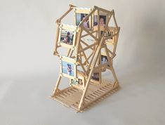 a small wooden structure with pictures on it