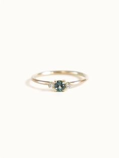 A classic teal blue green three-stone Sapphire ring with diamond accents. Dainty Wedding Ring Green, Small Dainty Engagement Rings, Small Italian Wedding, Boho Wedding Rings, Dark Green Ring, Small Engagement Ring, Mens Engagement Rings, Three Stone Sapphire Ring, Sapphire Gold Ring