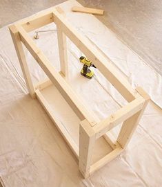 an unfinished table being built with tools