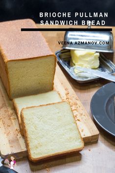 a loaf of bread sitting on top of a wooden cutting board