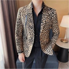 SPECIFICATIONS Clothing Length: Regular Applicable Scene: Party Material: COTTON Style: Dress up Applicable Season: Four Seasons Gender: MEN Item Type: Blazers Closure Type: Single Breasted Sleeve Length(cm): Full Elevate your style with this stylish leopard print suit jacket for men. Featuring a slim fit design and single breasted two button closure, this fashionable blazer is perfect for performances, parties, and other special events. The unique leopard print pattern adds a touch of wildness Slim Fit Blazer With Suit Collar For Party, Party Outerwear With Suit Collar And Buttons, Slim Fit Suit Collar Outerwear For Party, White Single Breasted Outerwear For Party, White Single Breasted Party Outerwear, White Single-breasted Outerwear For Parties, Slim Fit Blazer For Winter Parties, Winter Party Slim Fit Blazer, White Party Outerwear With Button Closure