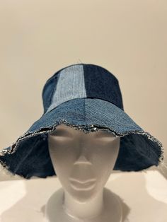 Handmade up cycled denim bucket hat. Unfinished brim edge. Lined with cotton print fabric. Crown features an functional front jean pocket. 23 inches around. various shades of denim. Great casual sun hat.  Easy care, wash with jeans. Fabric Crown, Denim Bucket Hat, Jean Pockets, Bucket Hats, Sun Hat, Print Fabric, Sun Hats, Medium Size, Caps Hats