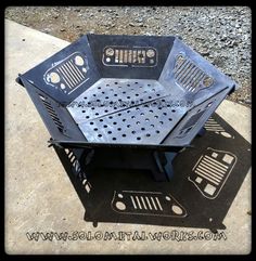 a metal fire pit sitting on top of a cement slab with holes in the middle