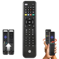 two remote controls are being held up in front of the camera and another hand is holding one