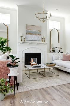 a living room filled with furniture and a fire place