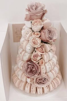 there is a cake made out of seashells and flowers