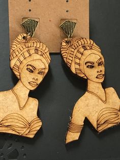 Folasade means, "honored with a crown," in the Yoruba language.  Wear these and exude the queenship that resides within. Item measures approximately 3.25 inches in length from post to base and 1.75 inches in width at its widest point. Laser cut. Handmade in Brazil. Hand-tooled Brown Earrings For Festival, Yoruba Language, Laser Cut, Labour Day, Jewelry Earrings Dangle, Etsy Earrings, Dangle Drop Earrings, Beauty Book, Dangle Earrings