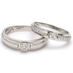 two white gold wedding rings with princess cut diamonds on each one and channel set in the middle