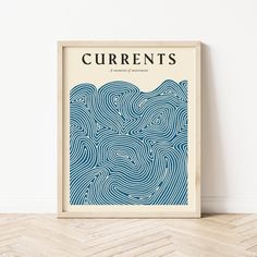 a framed poster with the words currents printed on it in front of a white wall